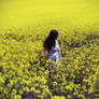 Woman in Colza field