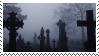 stamp of a foggy graveyard with several headstones