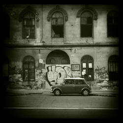 old car in front of an old house