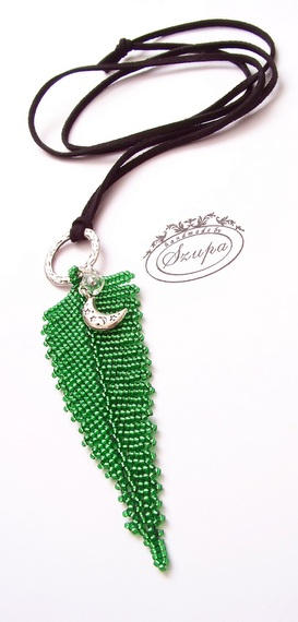 Necklace with a fern pendant