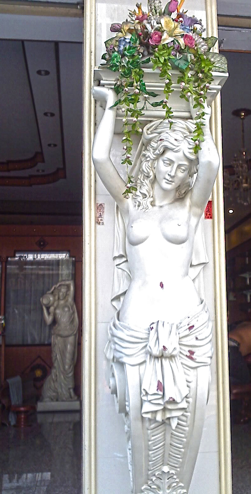 Toplesss woman statue