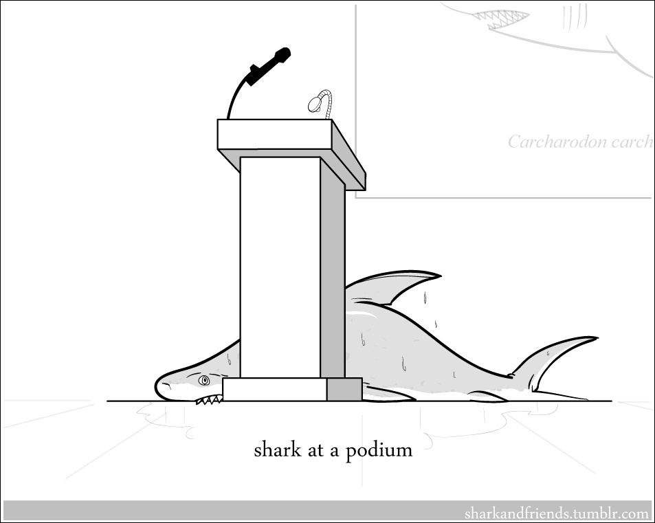 Shark at a podium