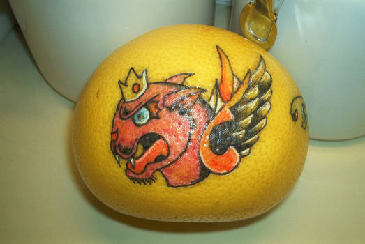 PANTHER ON GRAPEFRUIT TATTOO