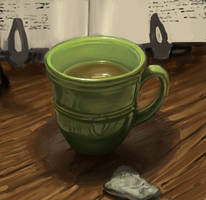 Green tea in green cup next to kneaded eraser