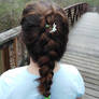 Braid my hair please? and can we add a flower?