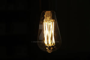 Light bulb filament glowing