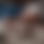 Obese granny eating candy bar naked lying on carpe