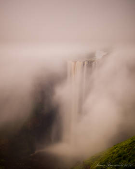 Water falls through mist