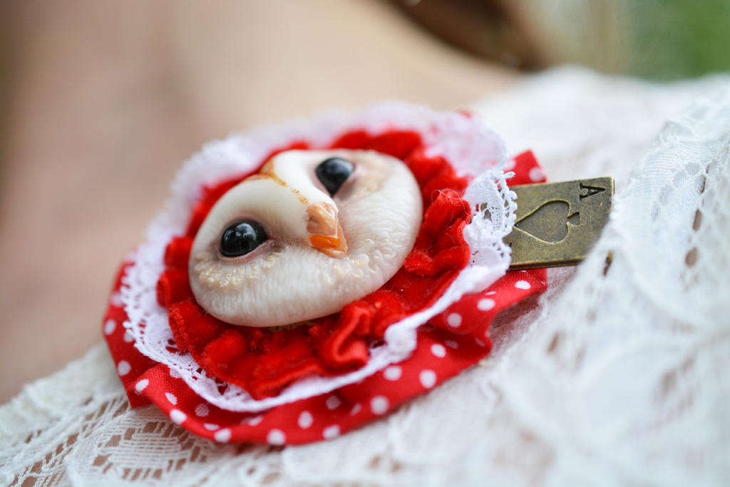 Barn owl brooch with playing card