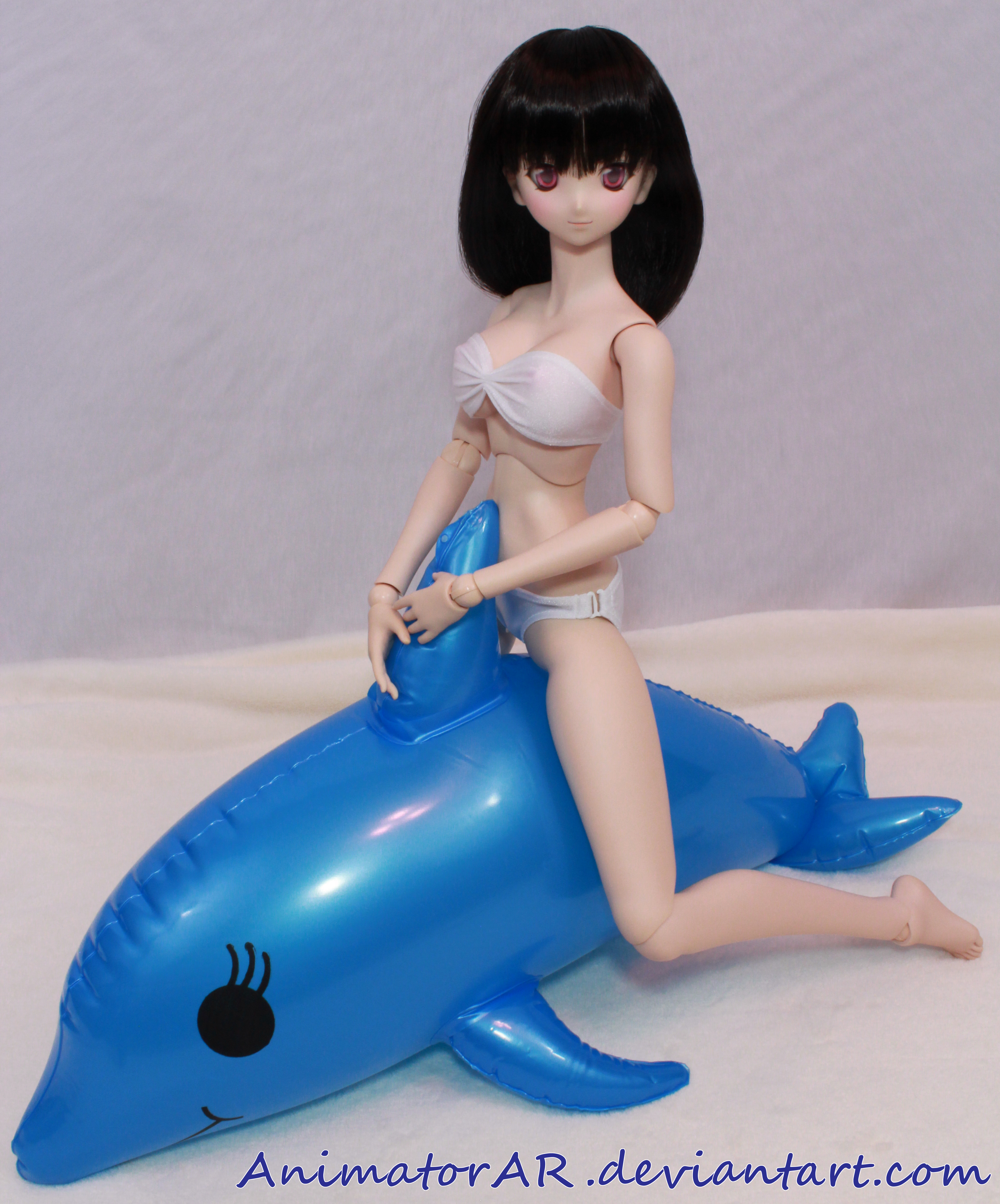 Sharon Riding a Dolphin