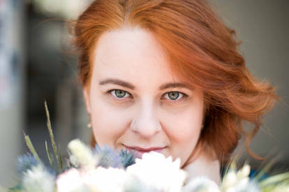 Green-eyed, red-headed bridal goddess