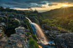 Loup of Fintry Sunset Waterfall by boldfrontiers