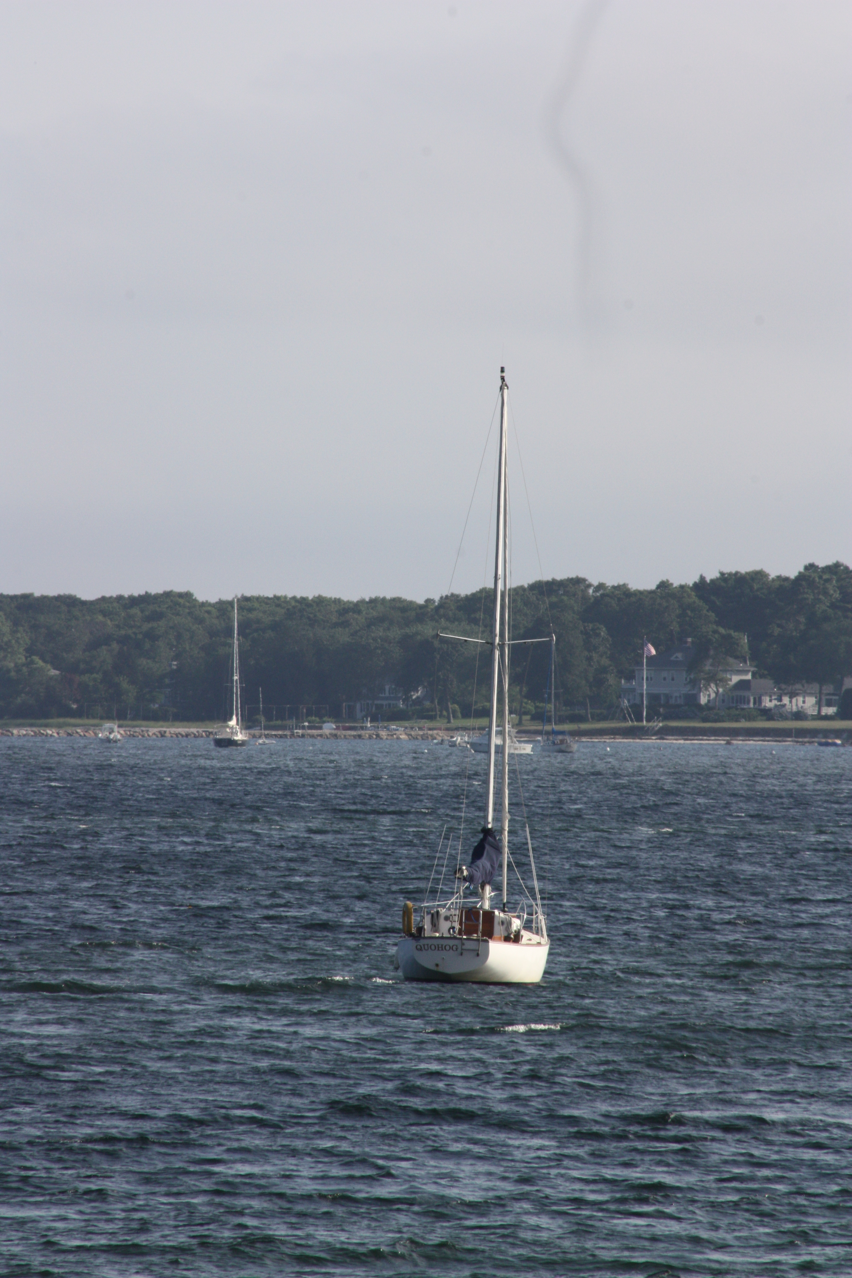 Anchored Sailboat at Sunset