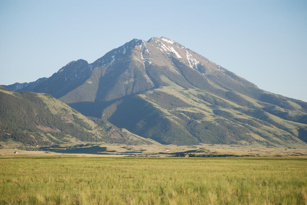 Green fields and a mountain peak