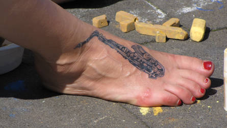 bare feet with tattoo
