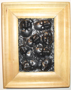 Barbie Faces in wood frame