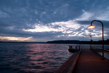 Dark Pier after Sunset with Lampposts