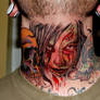 Zombie throat tattoo