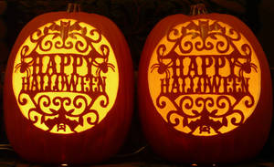 Happy Halloween hand-carved on a foam pumpkins