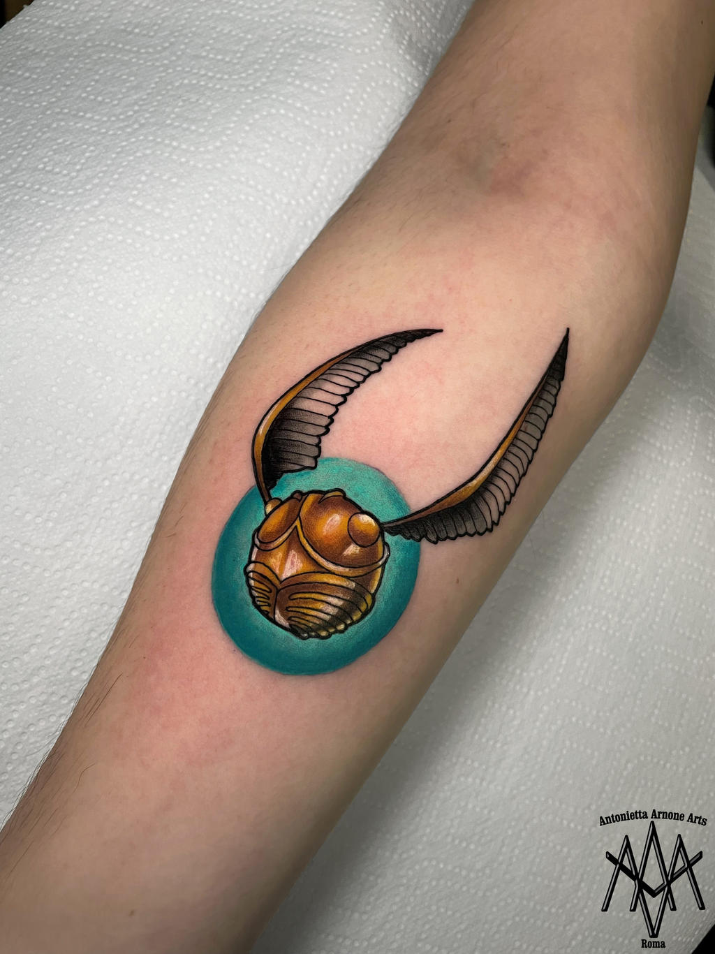 Golden snitch Harry Potter tattoo by AntoniettaArnoneArts on