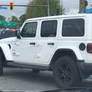 White Jeep Wrangler Unlimited Sahara