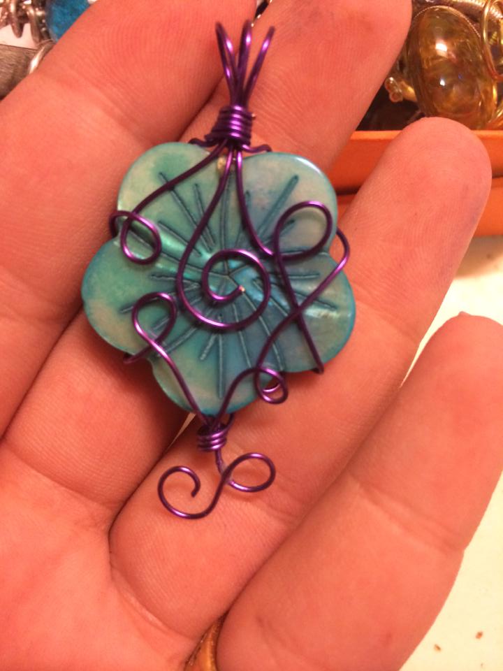 blue and purple flower pendant