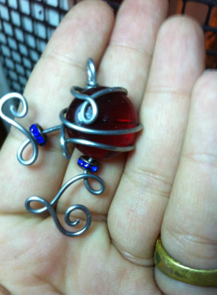 red blue and silver pendant