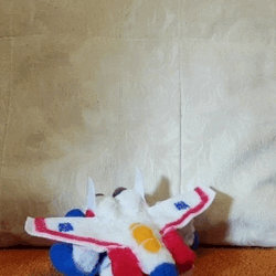 GIF of Plush Starscream transforming