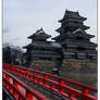 red bridge against the castle