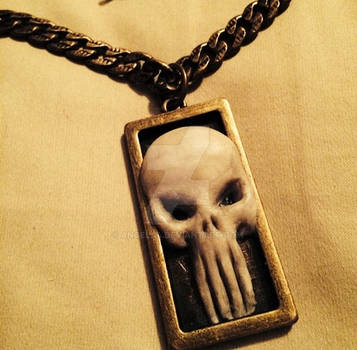 Punisher logo pendant made out of polymer clay