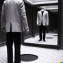 Invisible man looks at himself in the mirror