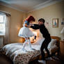 Fighting with a life sized doll in a bedroom weari