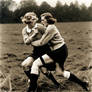 Two 1930's era women wearing jumpers and bulky whi