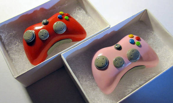 Red and Pink Xbox Controllers