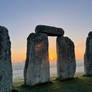 Stonehenge - megalithic gate with rising sun