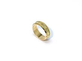 Golden ring with spiral decorations