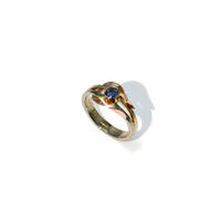 Tricolor ring with a sapphire