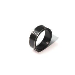 Black and white zirconium ring with a sapphire