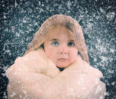 Little Child Outside with Winter Falling Snow