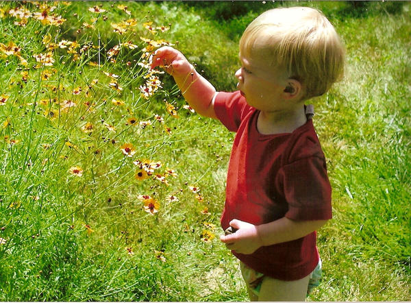 Aiden picking flowers