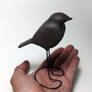 Hand carved walnut robin sculpture