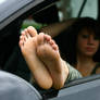 Franzi showing her soles of feet out of a car