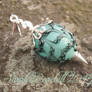 Mint green egg pendant with black lace