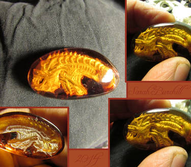 Alien Warrior amber carving