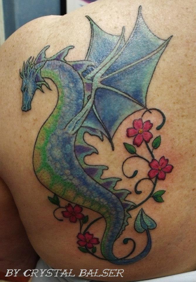 Dragon with flowers tattoo