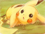 pikachu laying on the grass