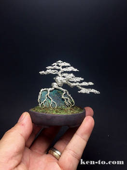 Silver root-over-rock wire bonsai tree by Ken To