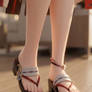 A cloes up on Yae Miko feet in her sandals