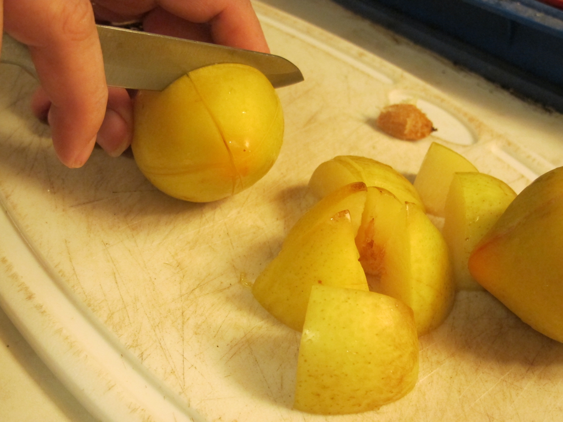 Green Plums Being Prepared