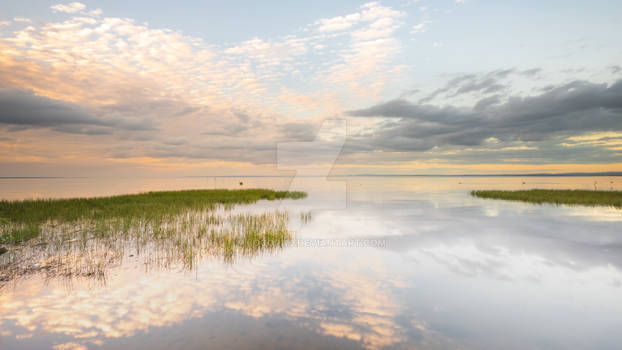 Reflections on a becalmed Lough Neagh